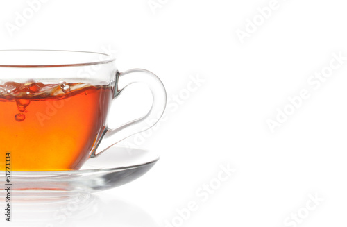 Tea with air bubbles isolated in white