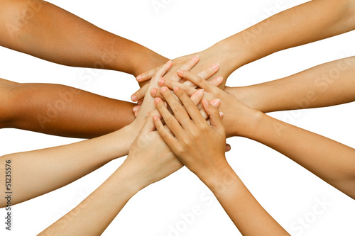 team showing unity, people putting their hands together