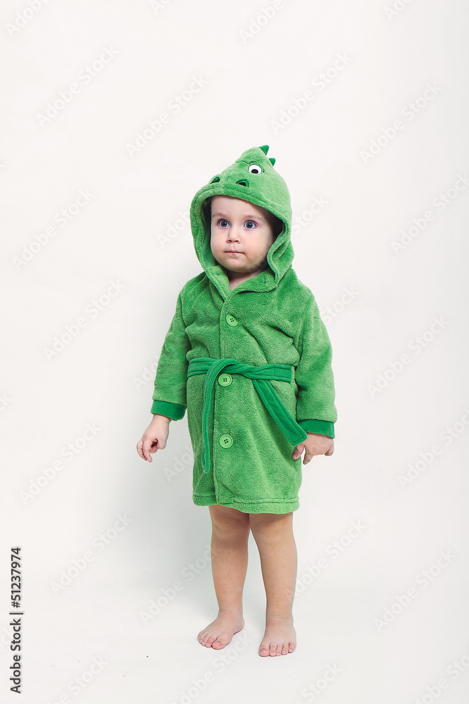 Portrait of a cheerful baby boy with blue eyes in green bathrobe Portrait of a cheerful baby boy with blue eyes in green bathrobe