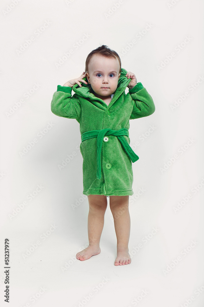 Portrait of a cheerful baby boy with blue eyes in green bathrobe Portrait of a cheerful baby boy with blue eyes in green bathrobe