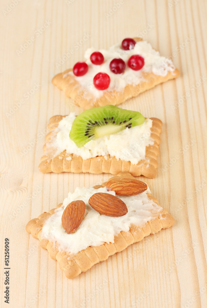 Tasty canapes with cheese, kiwi and cranberry, almond, Tasty canapes with cheese, kiwi and cranberry, almond,
