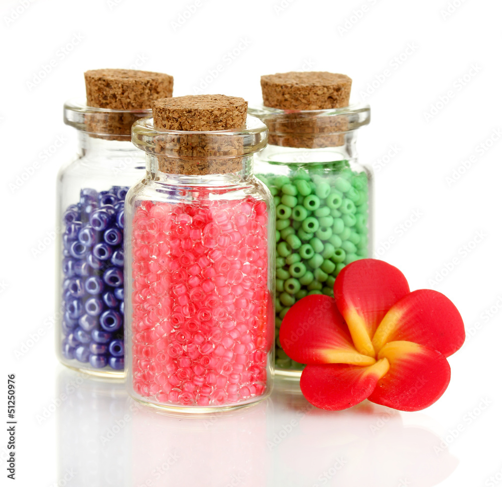 Little bottles full with colorful beads isolated on white Little bottles full with colorful beads isolated on white