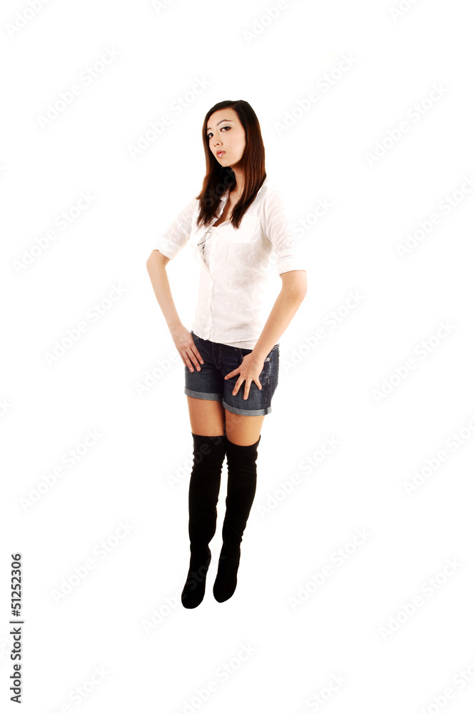 A girl in shorts and boots. A girl in shorts and boots.