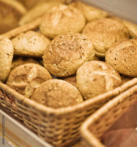 assortment of baked bread in basket. series