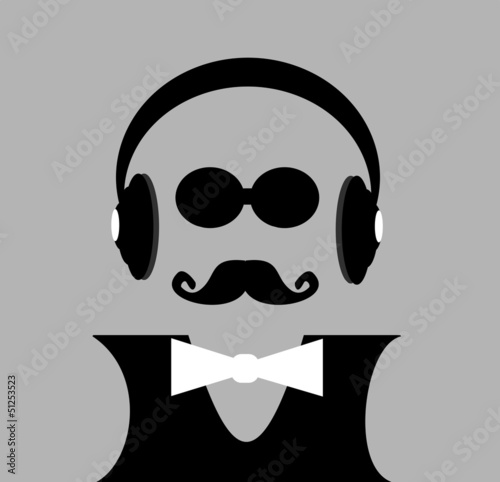 bald man with headphones and bow tie