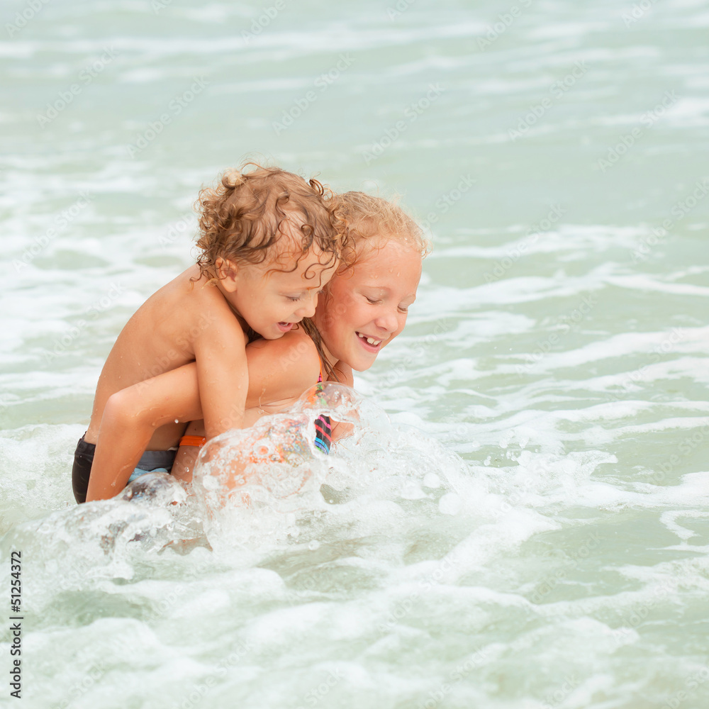 happy kids playing on the beach happy kids playing on the beach