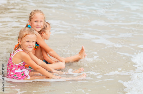 happy kids playing on beach