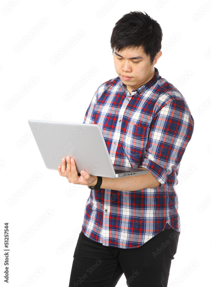 Young asian man using computer Young asian man using computer