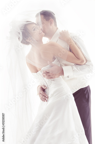 Wedding couple kissing and happy smiling. Bride portrait