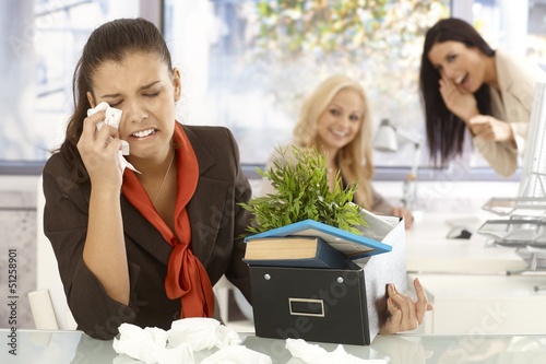 Fired office worker crying at office photo