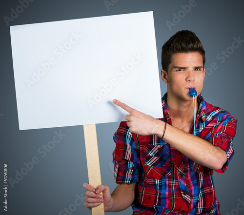 Young man protesting with protest sign