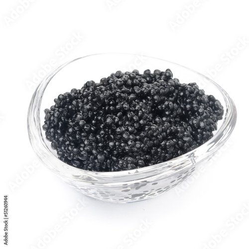 black caviar in a glass bowl isolated closeup