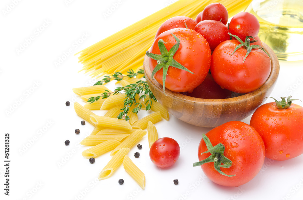 fresh tomatoes, penne pasta, spaghetti and spices on white fresh tomatoes, penne pasta, spaghetti and spices on white
