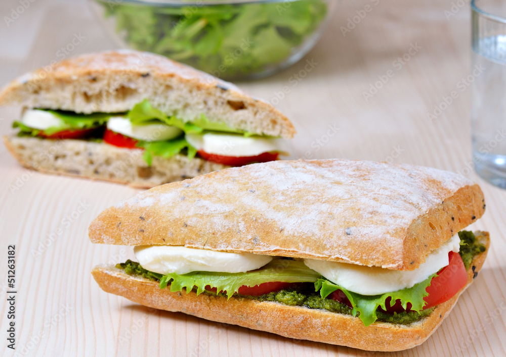 fresh sandwich with mozzarella, tomatoes and pesto fresh sandwich with mozzarella, tomatoes and pesto