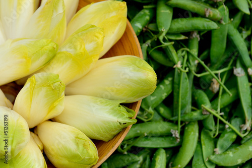 Heap of belgian endive and peas