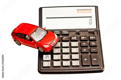 Toy car and calculator over white