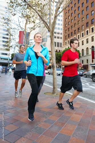 Group Of Runners On Urban Street