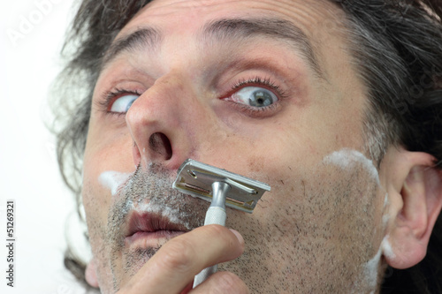 shaving with vintage razor photo