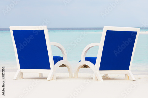 Empty Chairs On Beautiful Tropical Beach © Monkey Business
