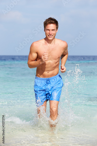 Man Splashing In Beautiful Tropical Sea