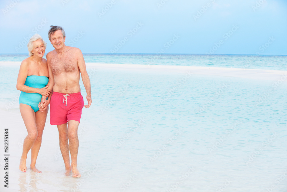 Senior Romantic Couple Walking In Beautiful Tropical Sea