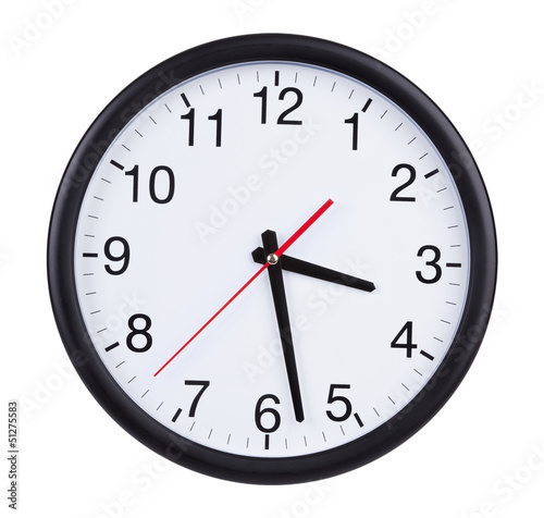 Office clock shows half of the fourth