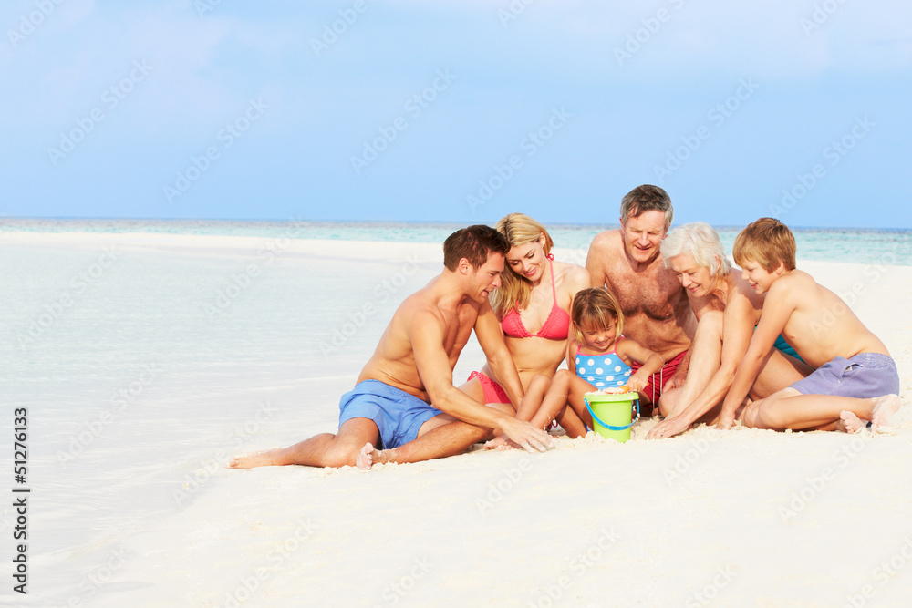 Multi Generation Family Having Fun On Beach Holiday Multi Generation Family Having Fun On Beach Holiday