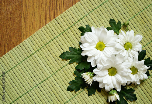 Daisies on a bamboo mat