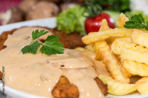 Schnitzel with Chips and Sauce photo