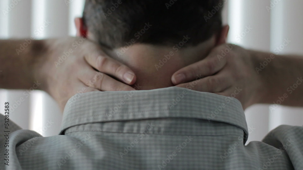 Close up of a man massaging his neck pain Close up of a man massaging his neck pain