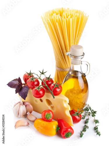 Still life with pasta ingredients isolated on white