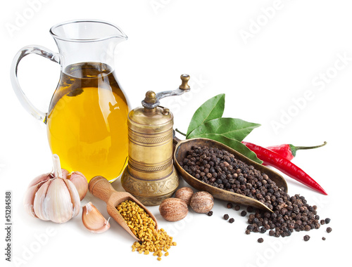 Retro still life with oil and spices isolated on white
