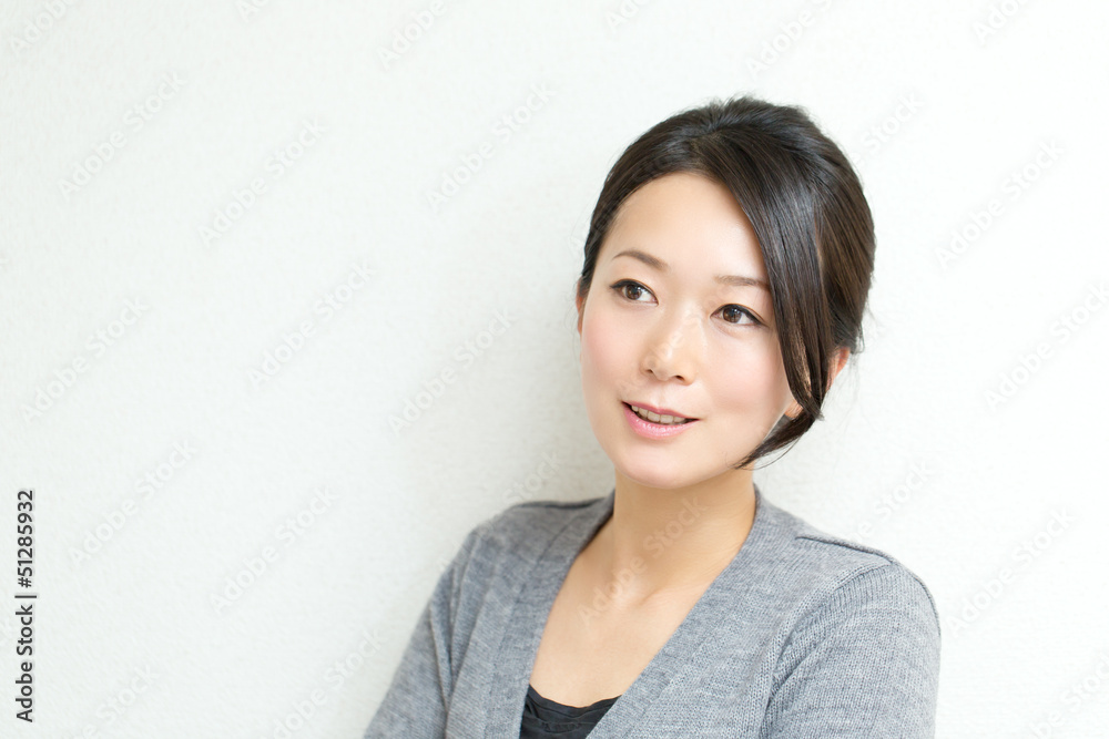 Beautiful asian woman relaxing on white background Beautiful asian woman relaxing on white background