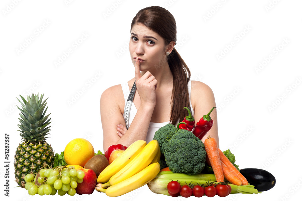 Mischievous look of a young woman with fruits Mischievous look of a young woman with fruits