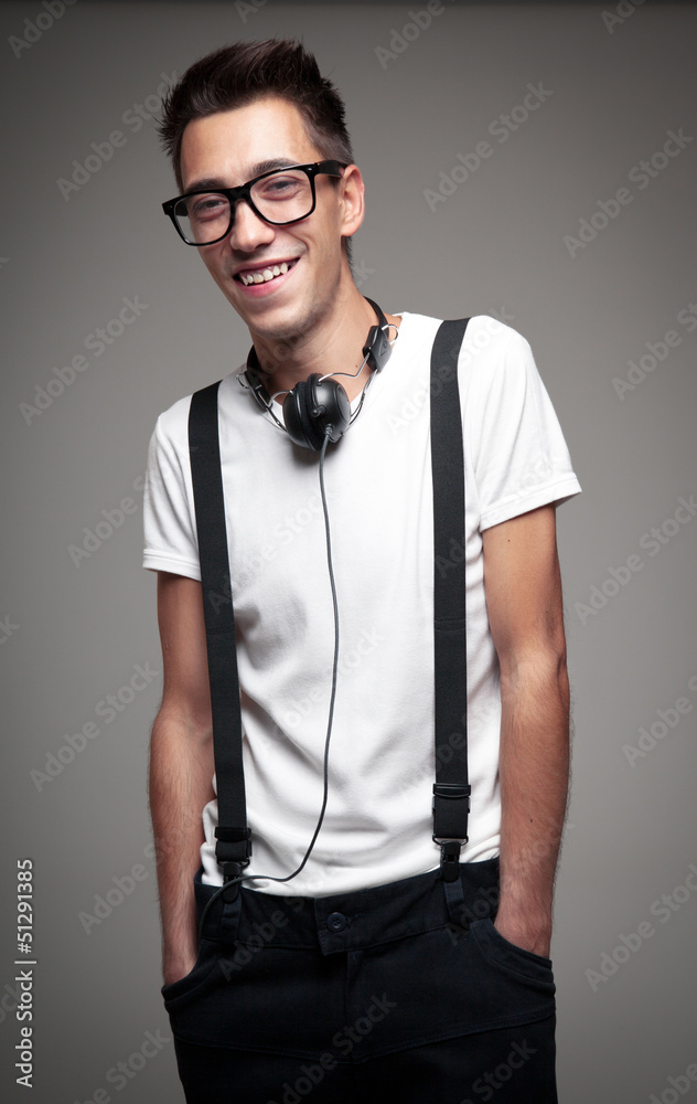 Portrait of a young man smiling with headphones Portrait of a young man smiling with headphones