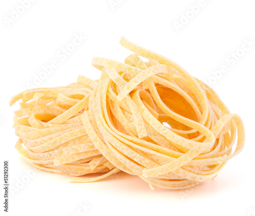 Italian pasta tagliatelle nest isolated on white background