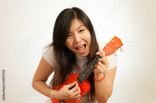 Aian woman enjoy her Ukulele