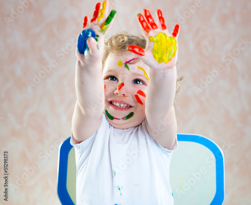 Fototapeta Naklejka Na Ścianę i Meble -  Happy child with painted hands