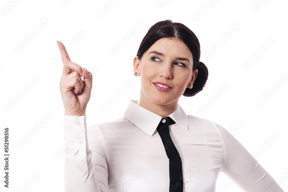 Businesswoman pointing to copy space Businesswoman pointing to copy space