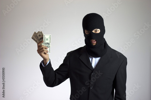 manager ladro con giacca elegante e soldi rubati photo