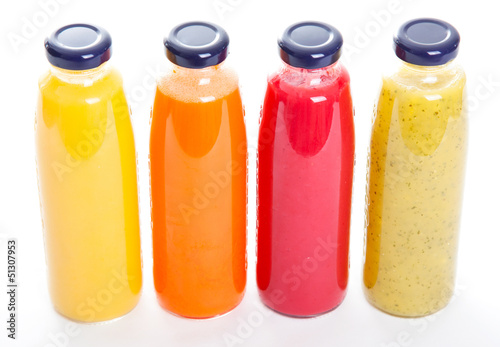 Bottles of fruit juice isolated on white background