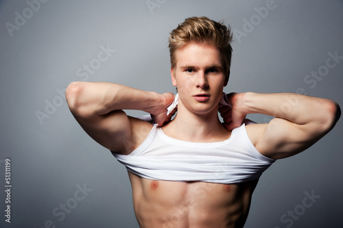 Young handsome blond man wearing t-shirt