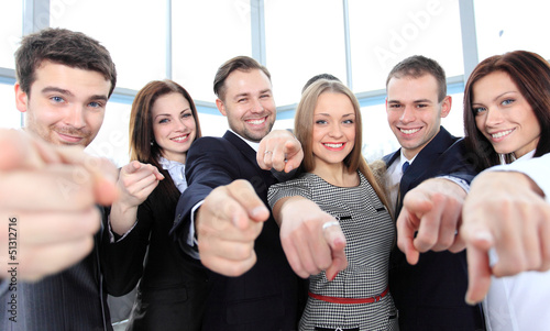 Happy diverse group of executives all pointing at you © opolja