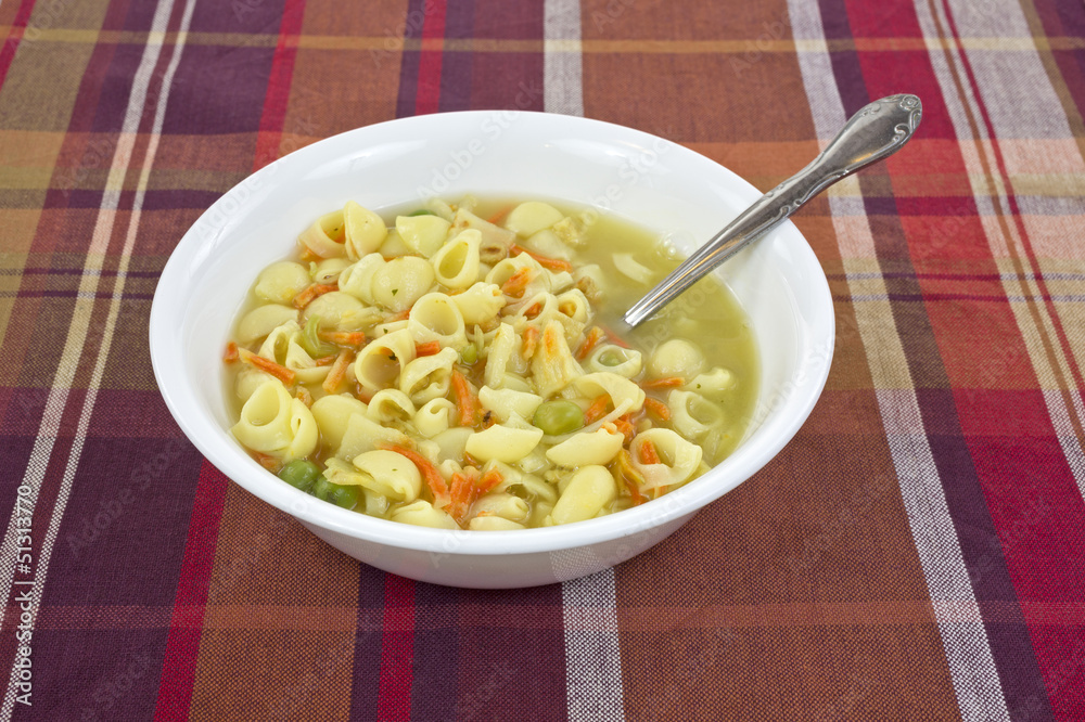 Chicken broth soup with spoon Chicken broth soup with spoon