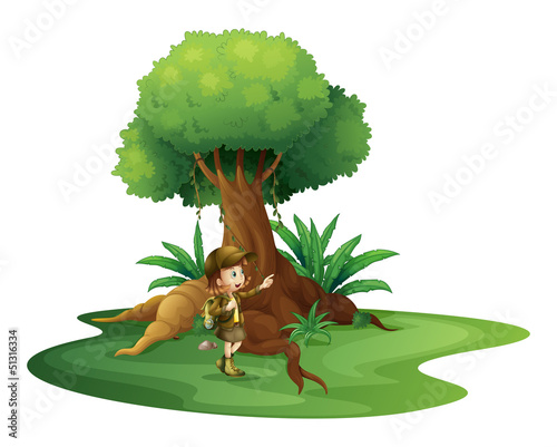 A girl standing near the big tree