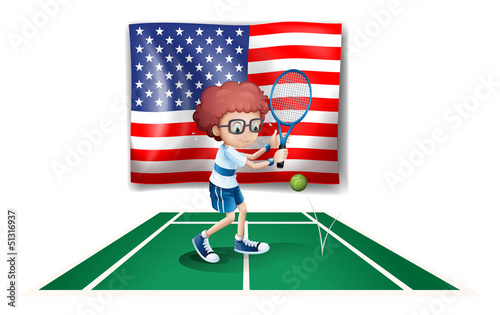 A tennis player in front of the USA flag