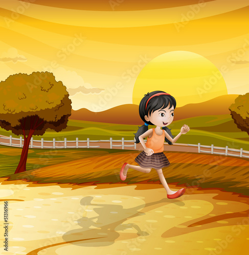 A girl running along the field
