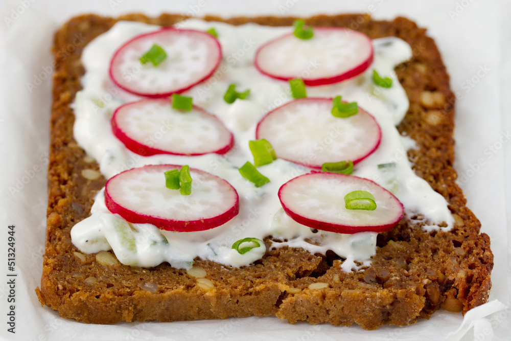 bread with cereals with cheese and radish