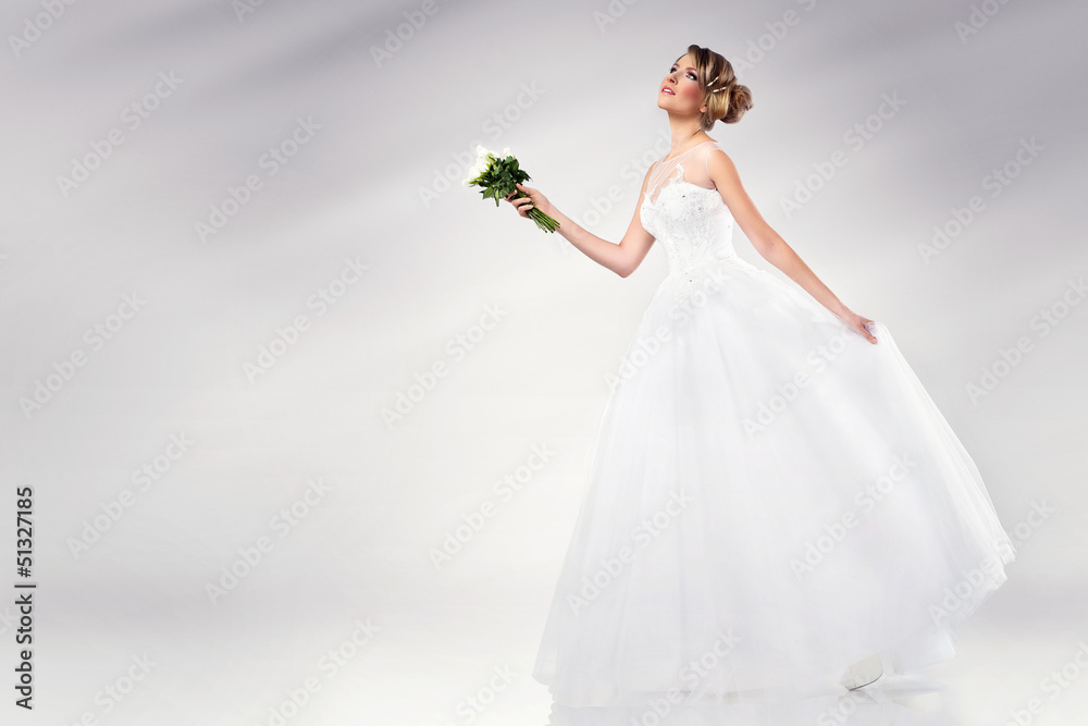 beautiful young bride wearing wedding dress holding flowers beautiful young bride wearing wedding dress holding flowers
