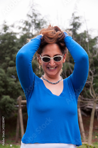 happy young woman wearing sunglasses